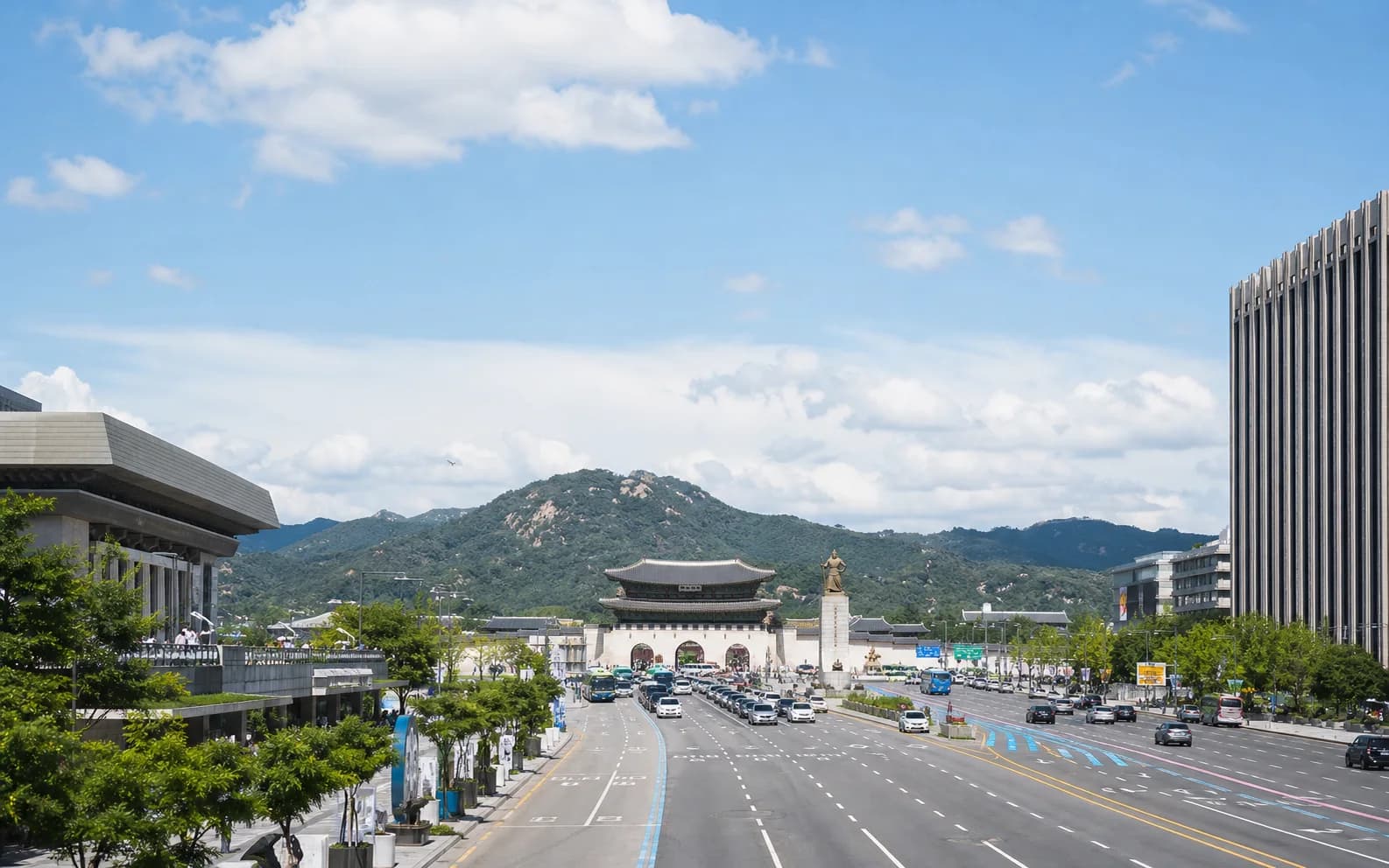 A bright editorial view toward Gwanghwamun in central Seoul
